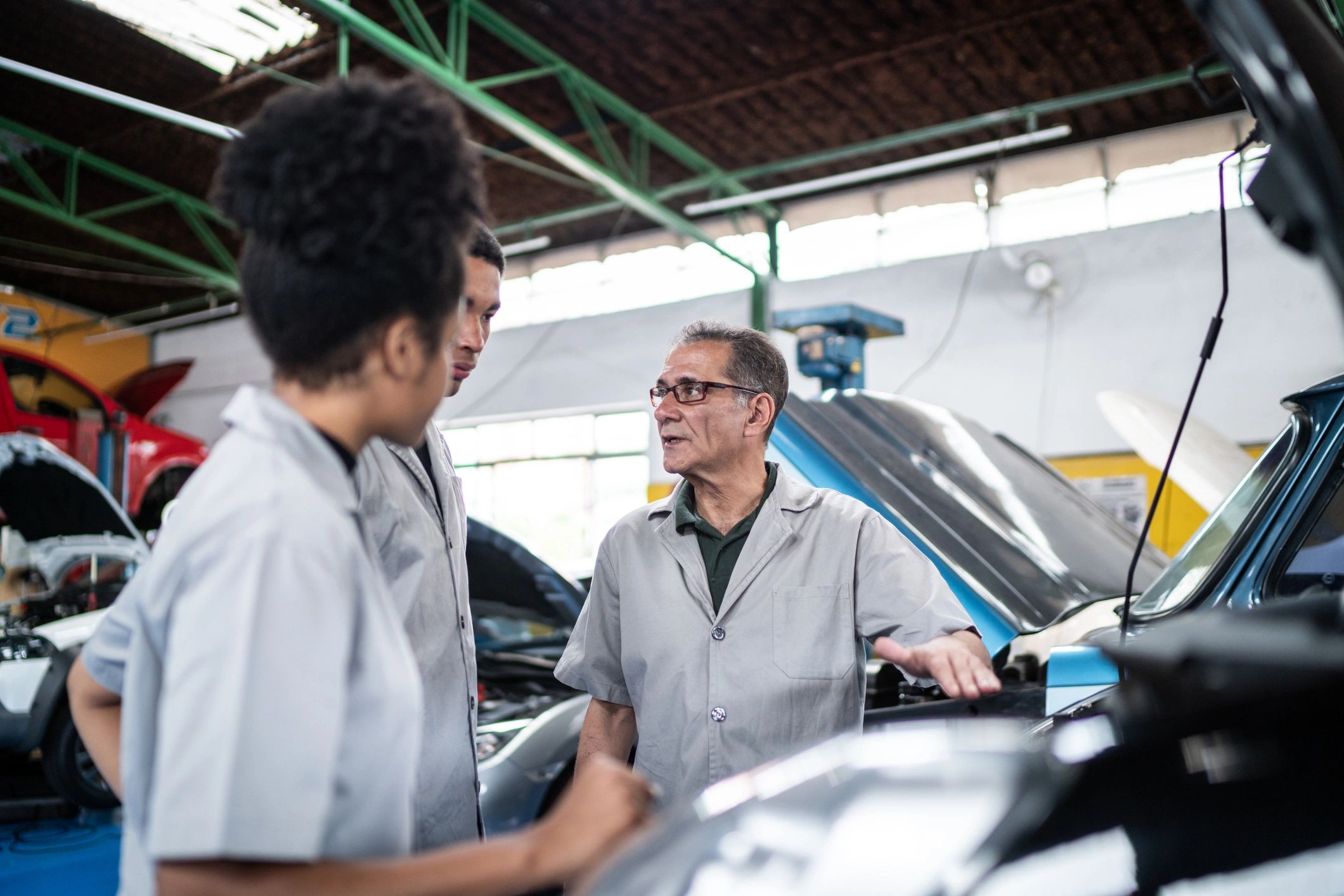 Service team collaborating in a repair setting